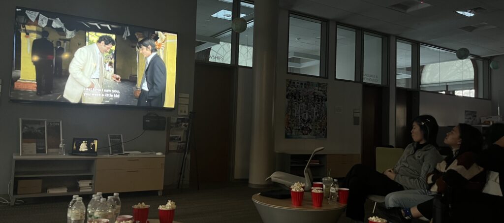 Students watch a movie together