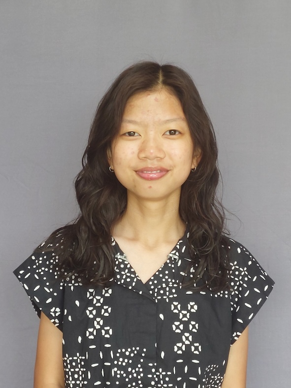 Maylyn posing with a gray background